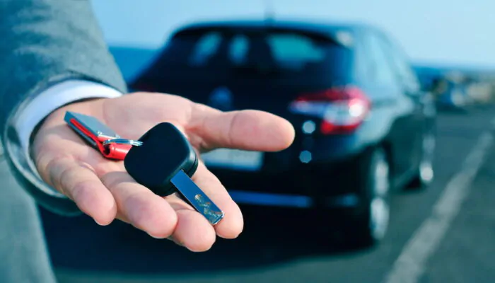 Man offering company car key